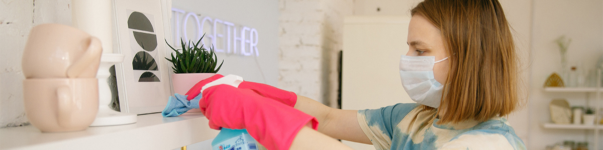 salesperson cleaning surfaces